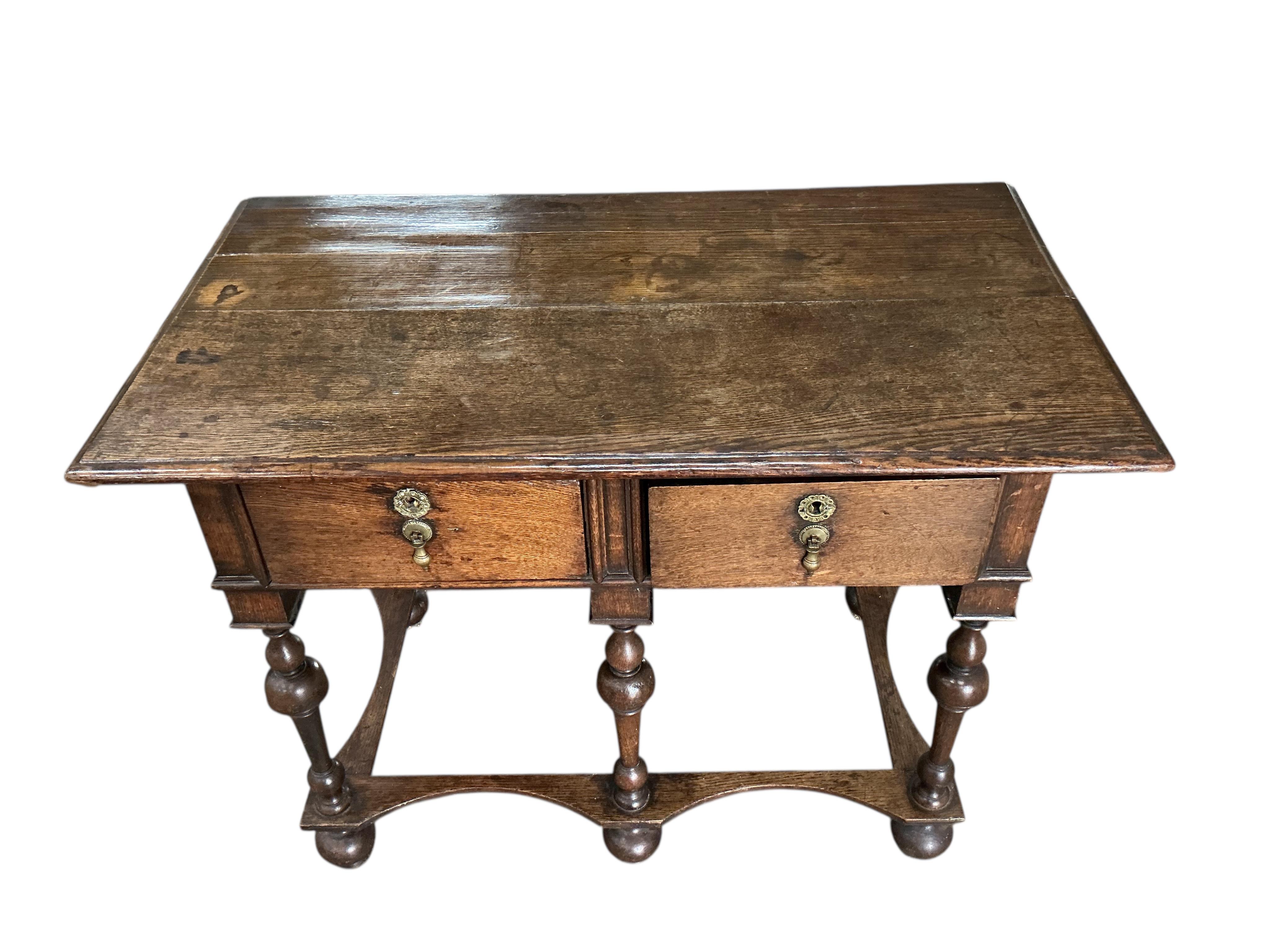 A William and Mary style oak two drawer side table, width 96cm, depth 54cm, height 72cm